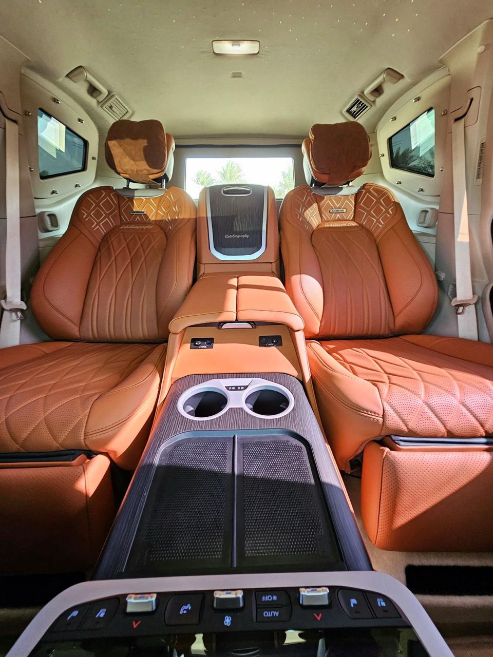 2025 Toyota Land Cruiser 300 VXR rear luxury seats with tan leather, entertainment screens and console