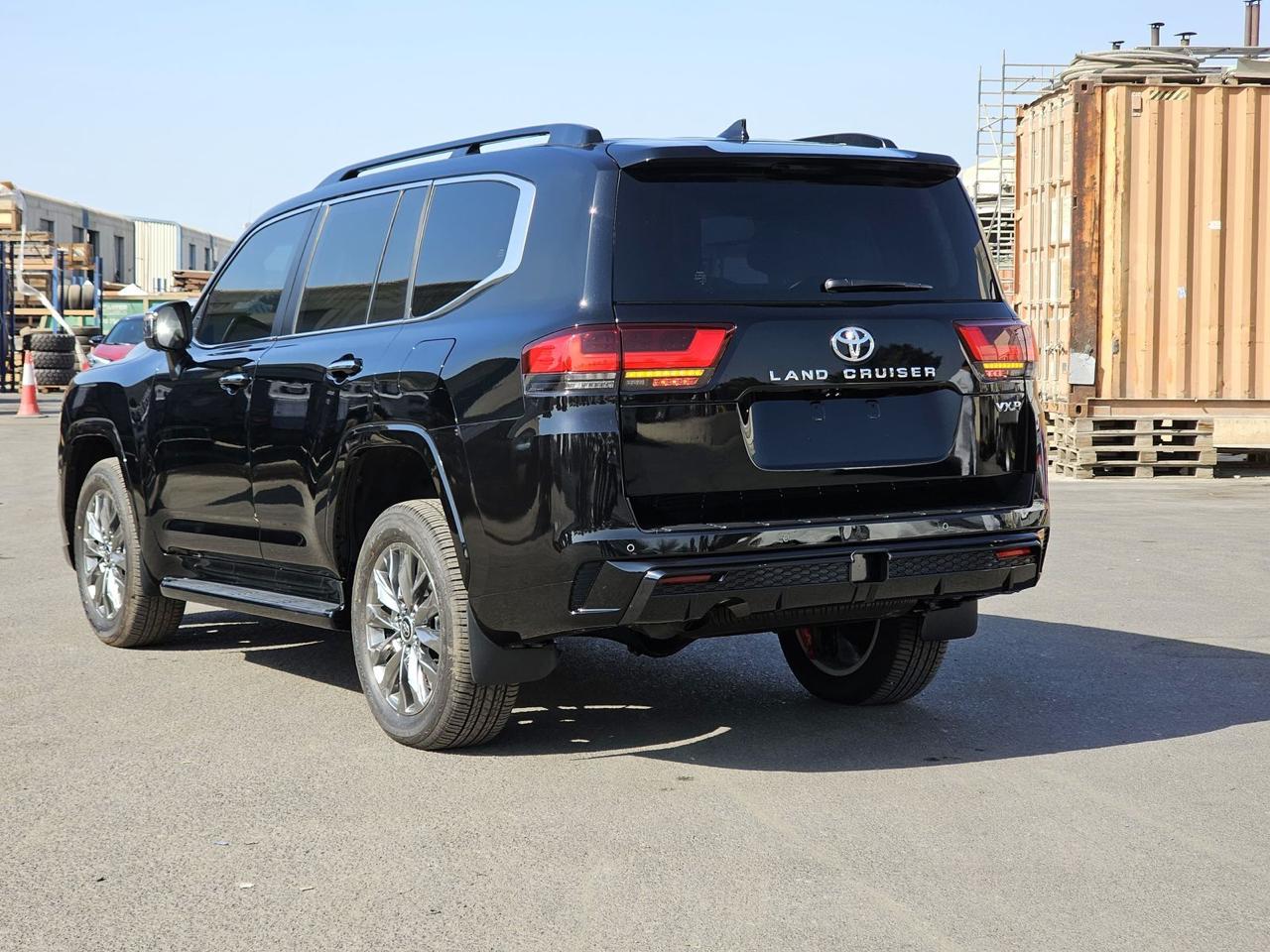 2025 Toyota Land Cruiser 300 VXR rear three-quarter view with alloy wheels and LED taillights