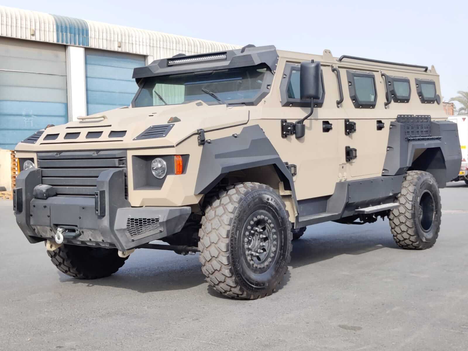 APC MONO-Q 4x4 armored personnel carrier front left view showing robust tactical design, reinforced chassis and bulletproof exterior for high-security transport in challenging environments