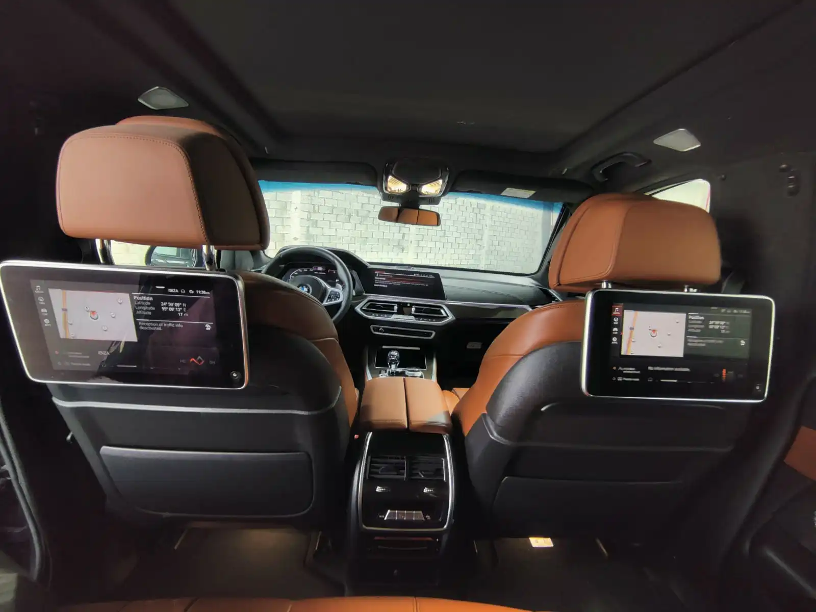 BMW X5 M50i grey armored luxury SUV rear seat screens