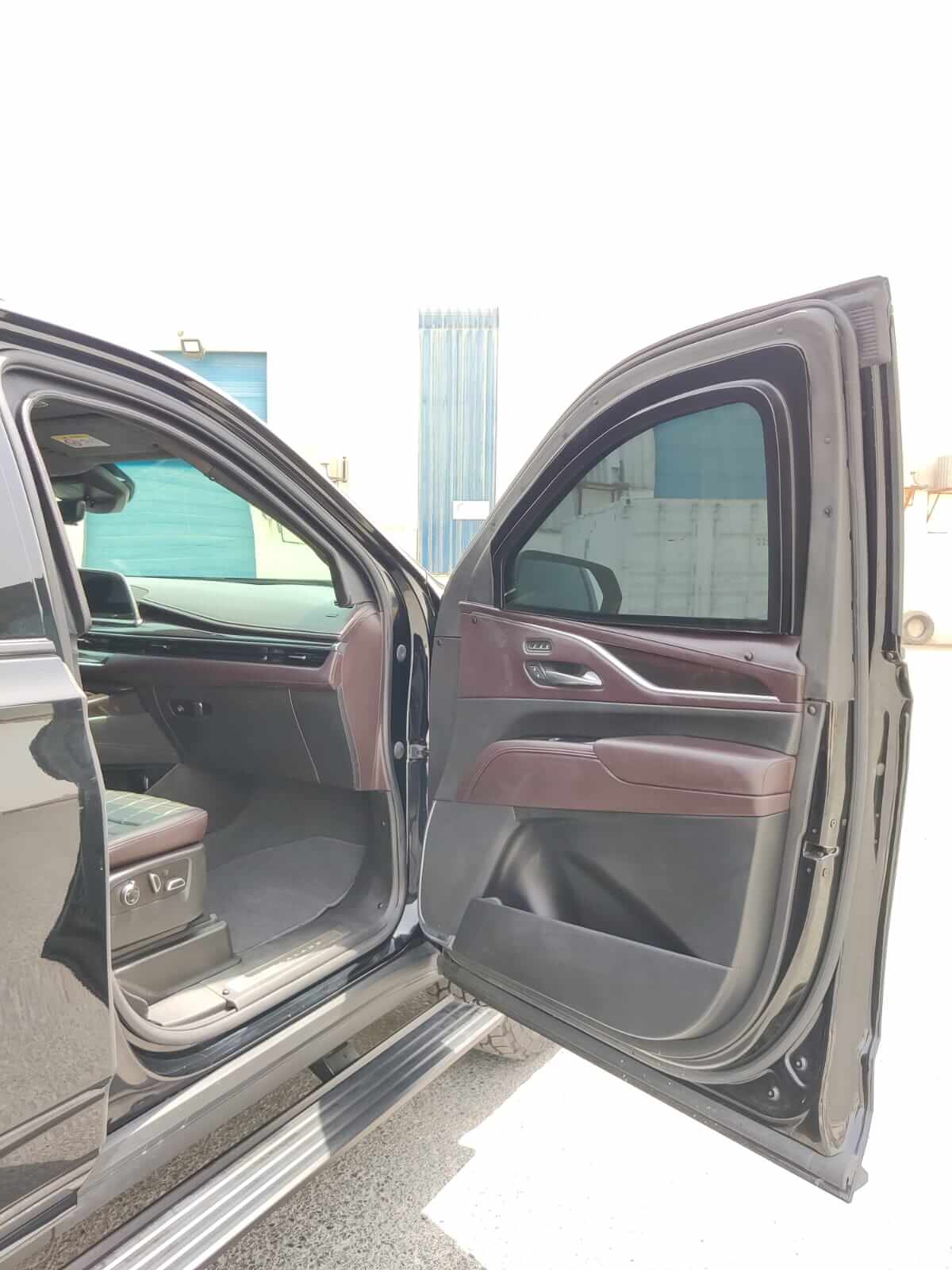 Cadillac Escalade armored luxury SUV front left door open view