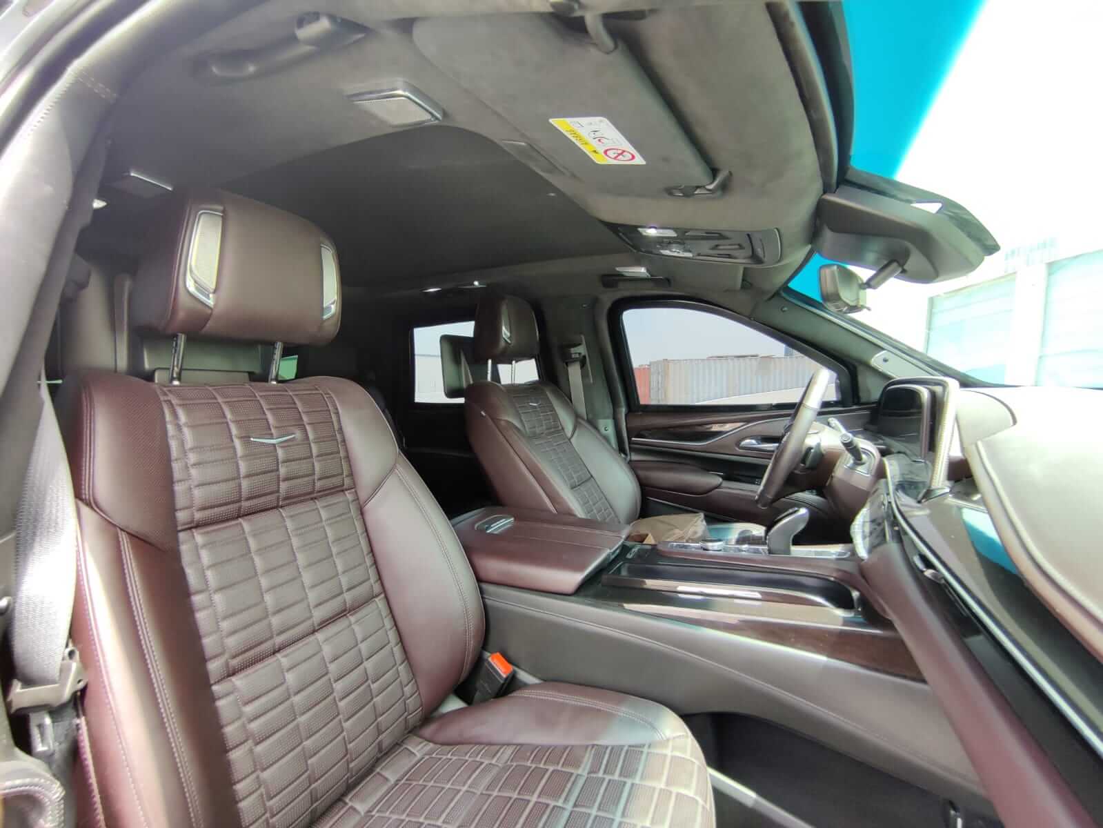 Cadillac Escalade armored luxury SUV rear interior seating view