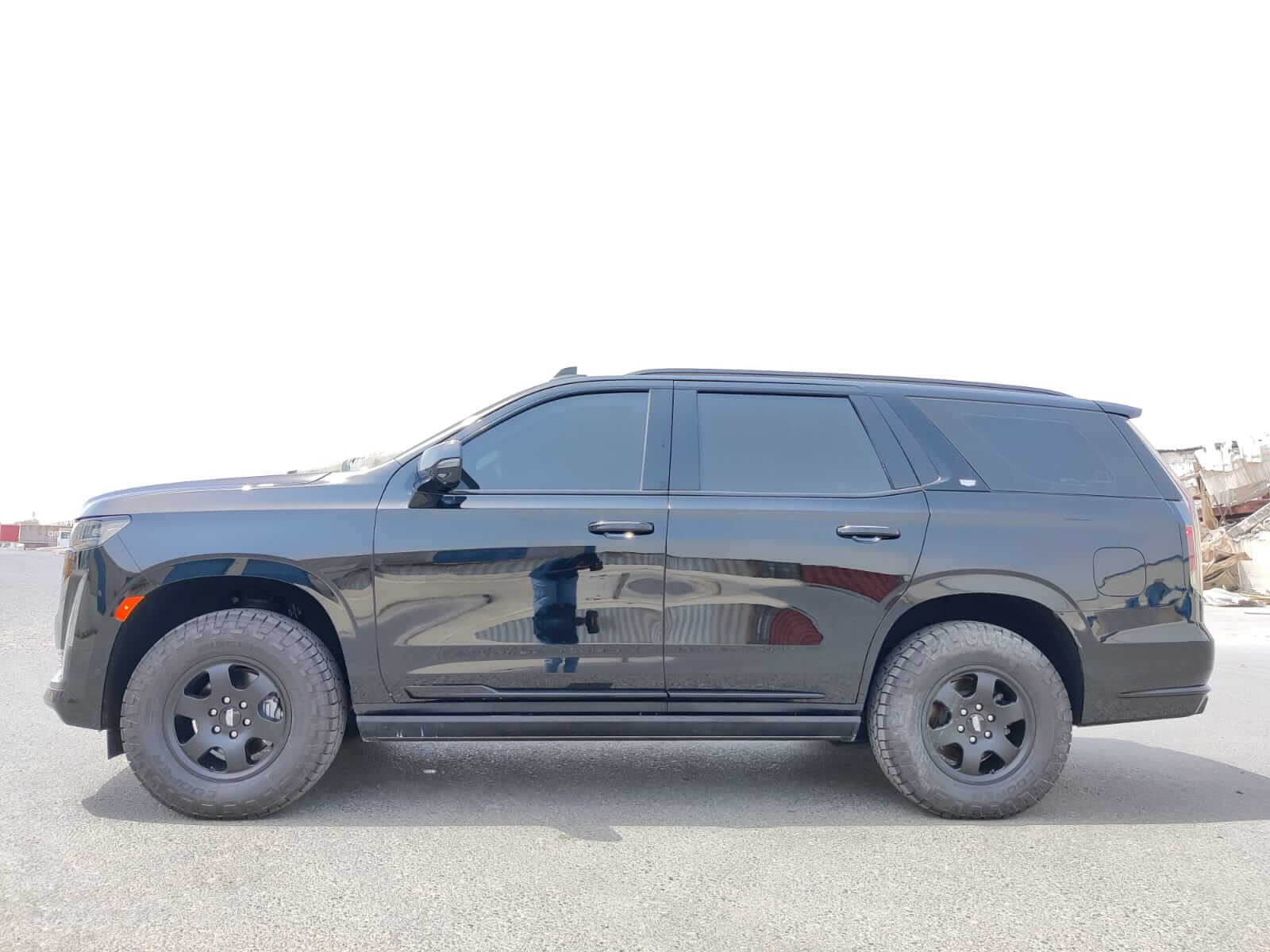 Cadillac Escalade armored luxury SUV right side tinted window detail