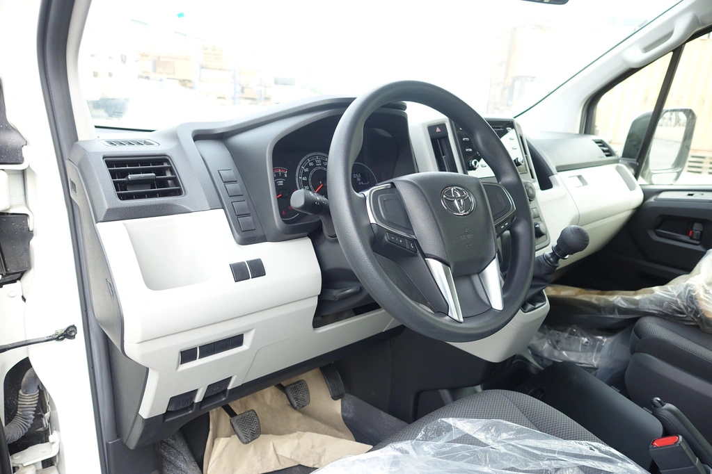 Armored Toyota HiAce 3.5L white passenger carrier front quarter view