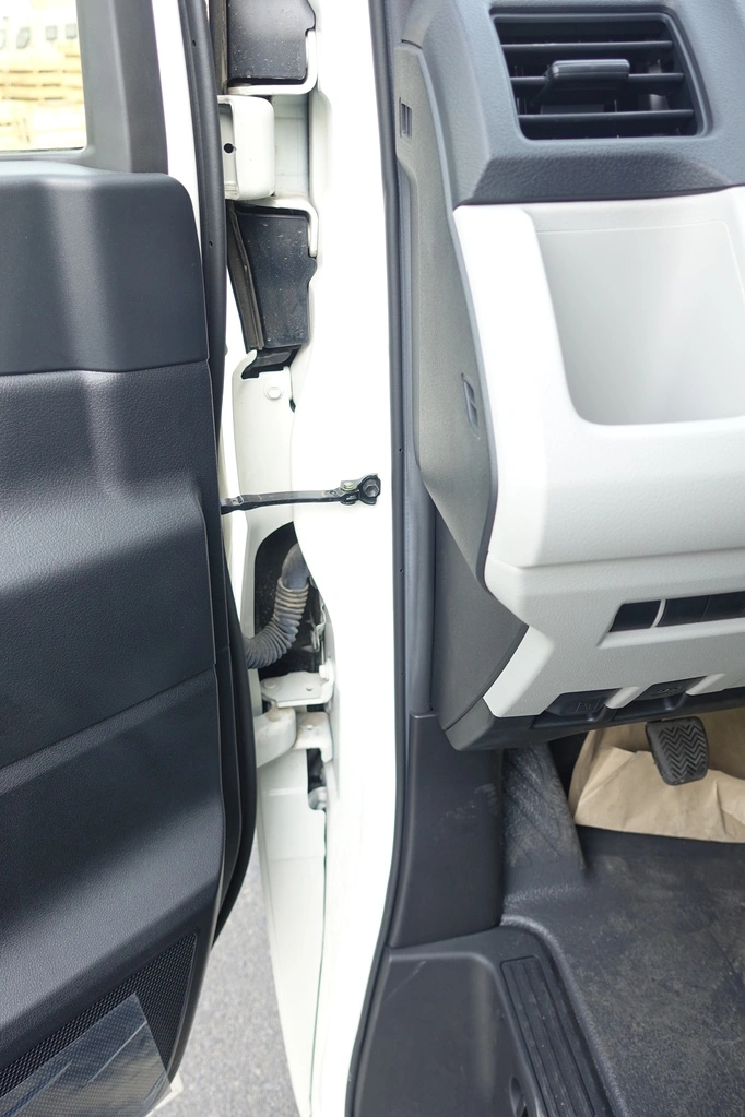 Toyota HiAce 3.5L rear three-quarter view with passenger van configuration