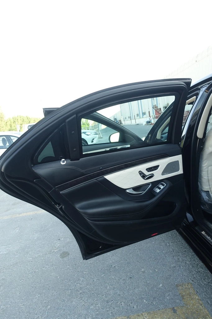 Mercedes-Benz S550 black sedan side profile with luxury armored stance