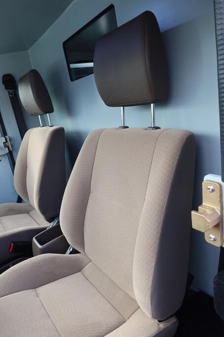 Fabric front seats in Toyota LC79 security vehicle with document compartment