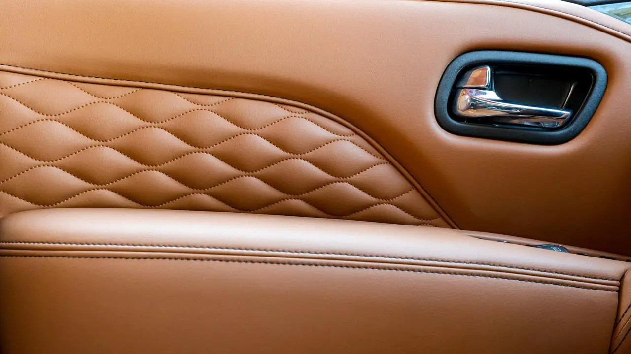 Infiniti QX80 4WD Extended armored luxury SUV door detail
