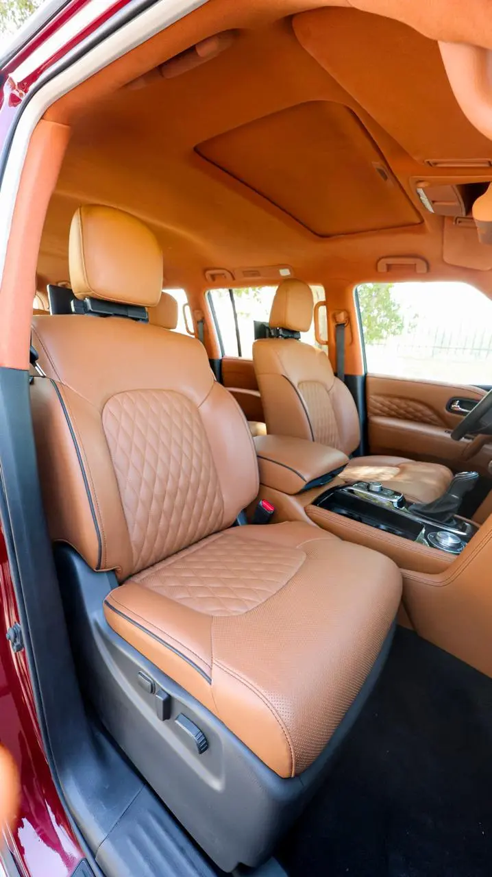 Infiniti QX80 4WD Extended armored luxury SUV full driver seat view