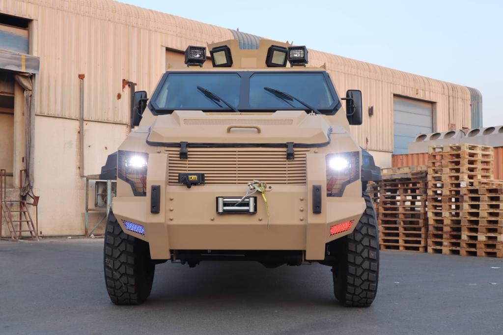 APC Jasar front view with lights on and armored exterior