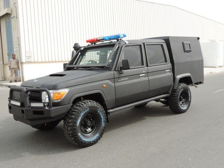 Toyota LC79 Troop Carrier Double Cab armored cash-in-transit vehicle with security module and off-road tires