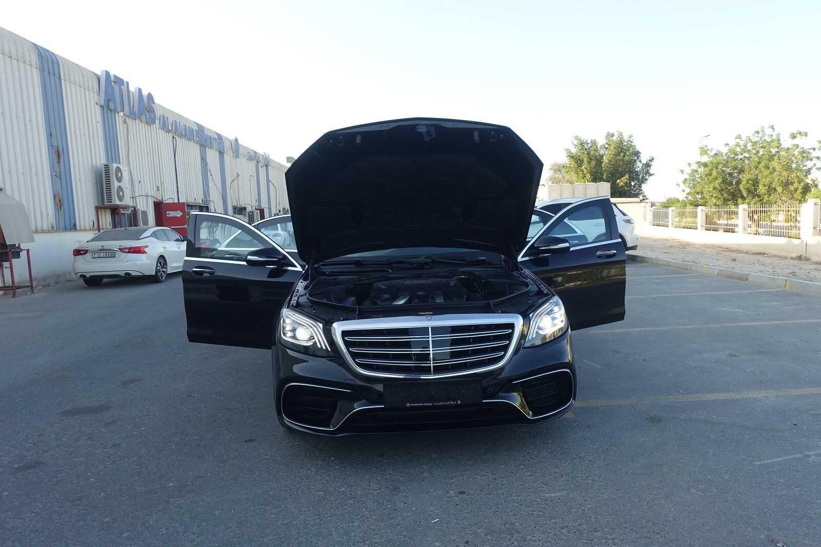 Mercedes-Benz S-Class armored luxury sedan front view with all doors open