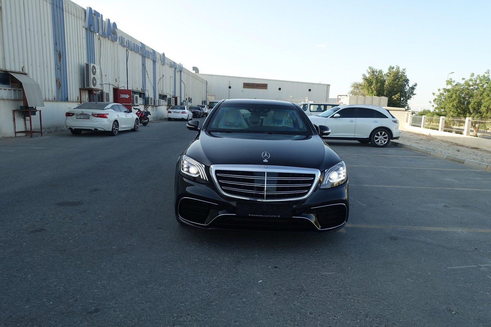Mercedes-Benz S-Class armored luxury sedan front view with lights on