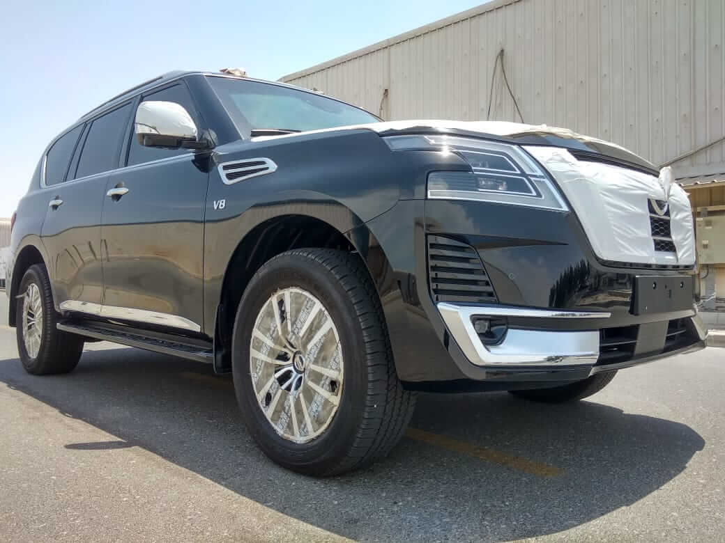 Nissan Patrol armored SUV front left angle with wheels visible