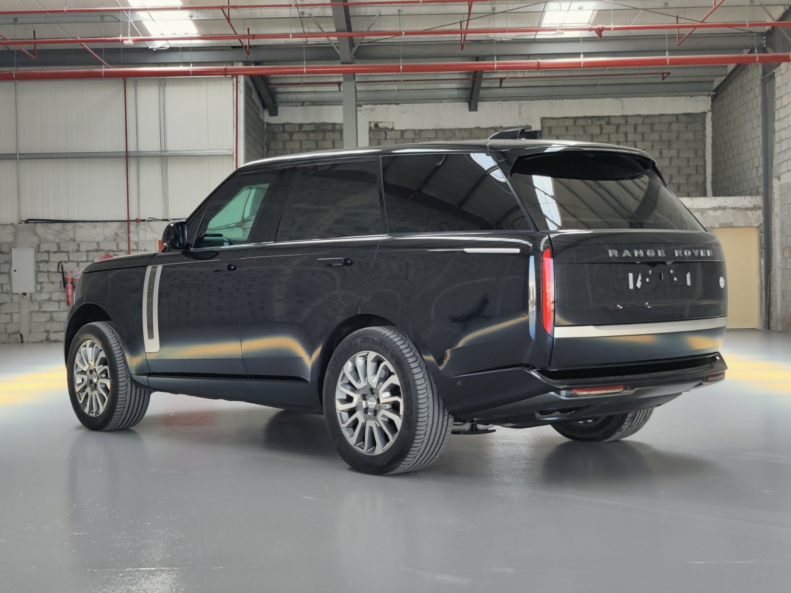 Range Rover SV 4.4L - Black in the Armored Luxury category - rear view, left side
