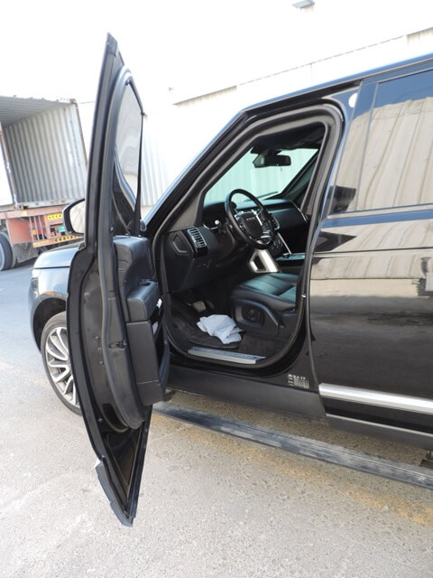 Range Rover Vogue armored luxury SUV driver door open view