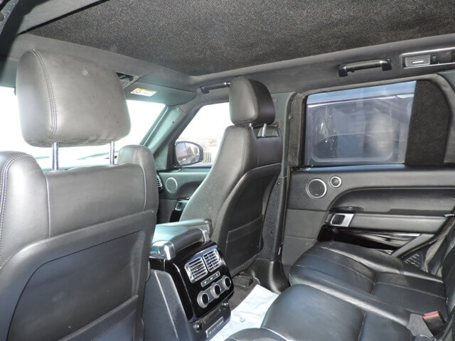 Range Rover Vogue armored luxury SUV rear cabin seating view