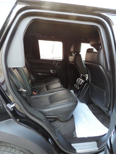 Range Rover Vogue armored luxury SUV rear passenger legroom view