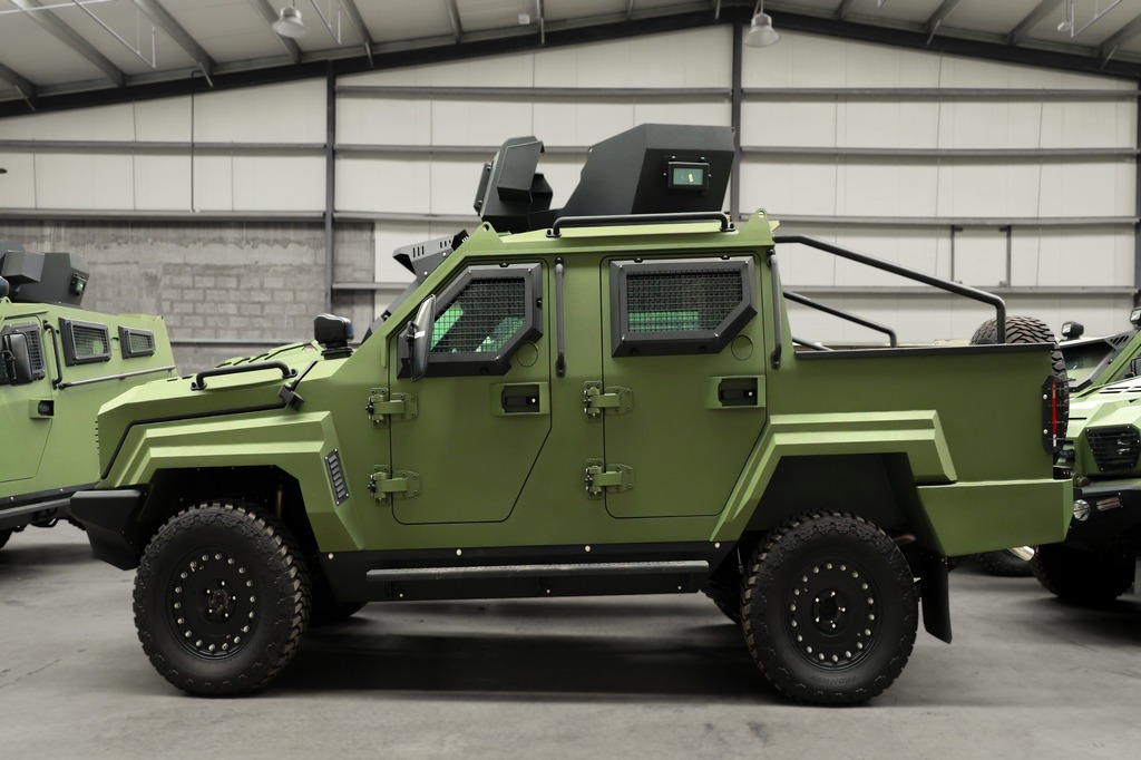 GER 1D MRAP side view with roof equipment and off-road tires