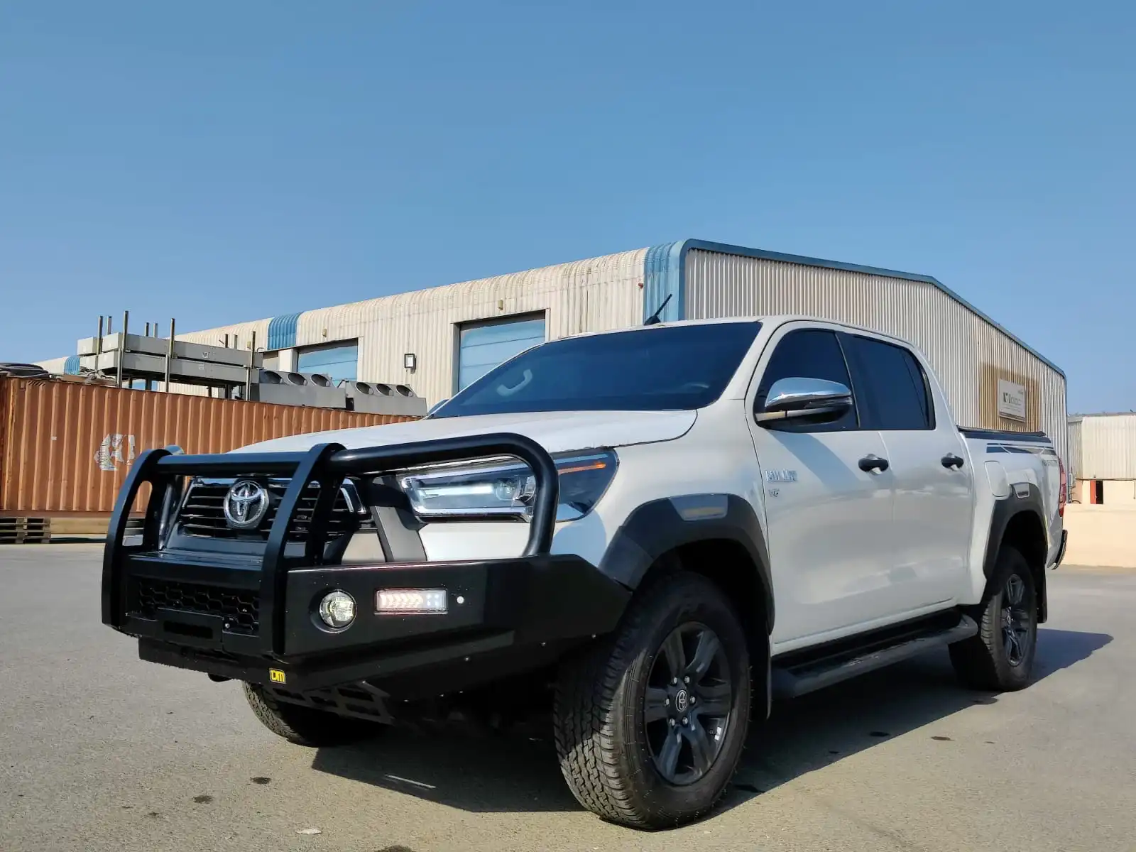 Toyota Hilux Adventure SR5 BR6 armored pickup front view with lights on