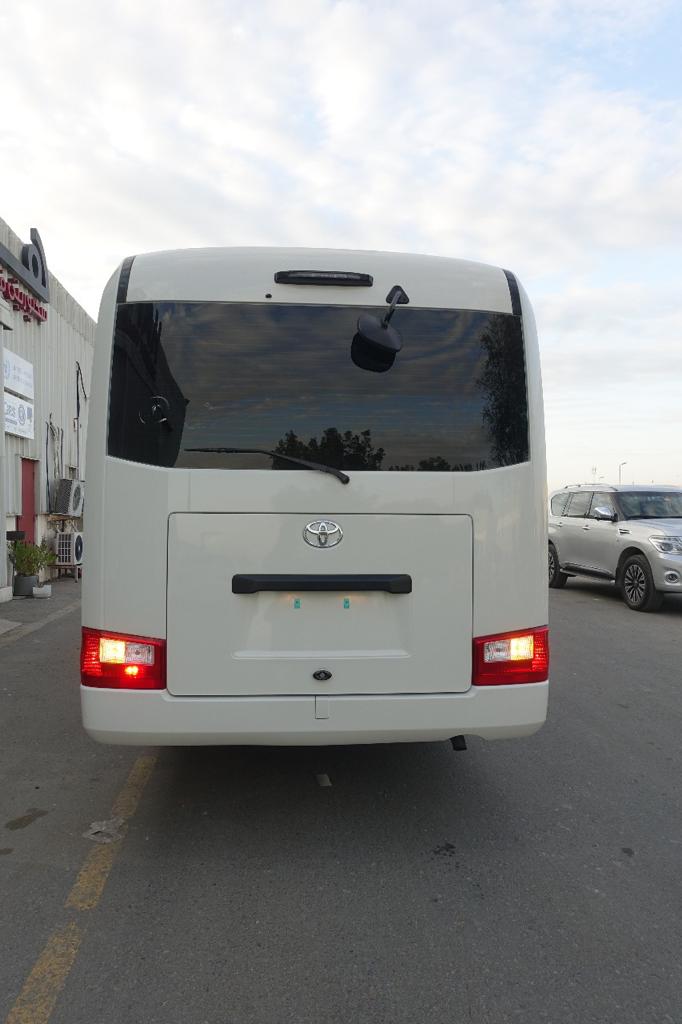 Toyota Coaster BR6 armored bus rear exterior view