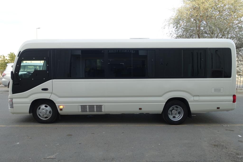 Toyota Coaster Bus BR6 armored passenger carrier full left side view