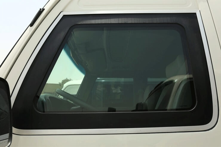 Toyota Coaster armored passenger carrier reinforced window view