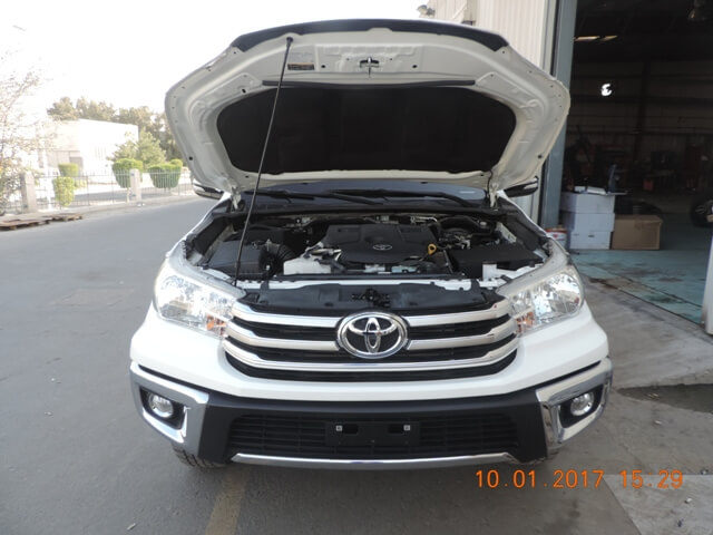 Toyota Hilux cash-in-transit vehicle front view with engine open