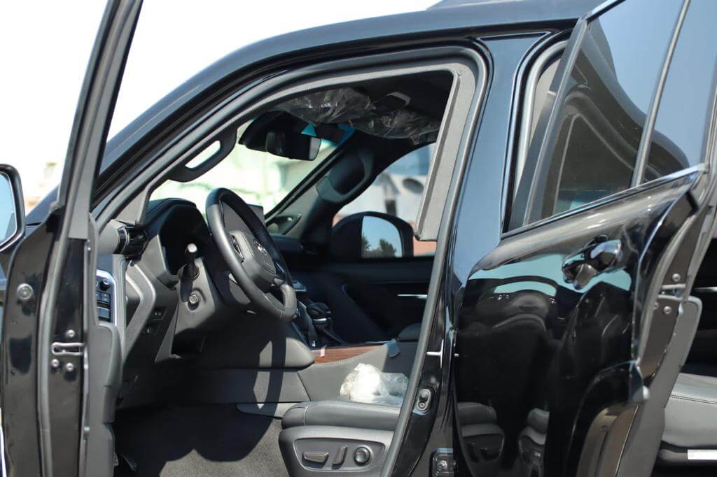 Toyota Land Cruiser 300 armored SUV driver door open view