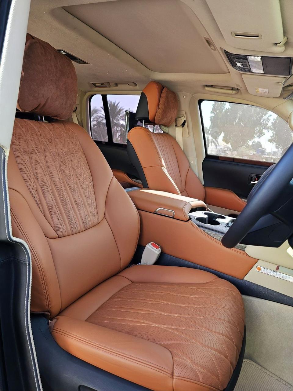 Toyota Land Cruiser 300 VXR front seats with tan leather, quilted stitching and wood trim
