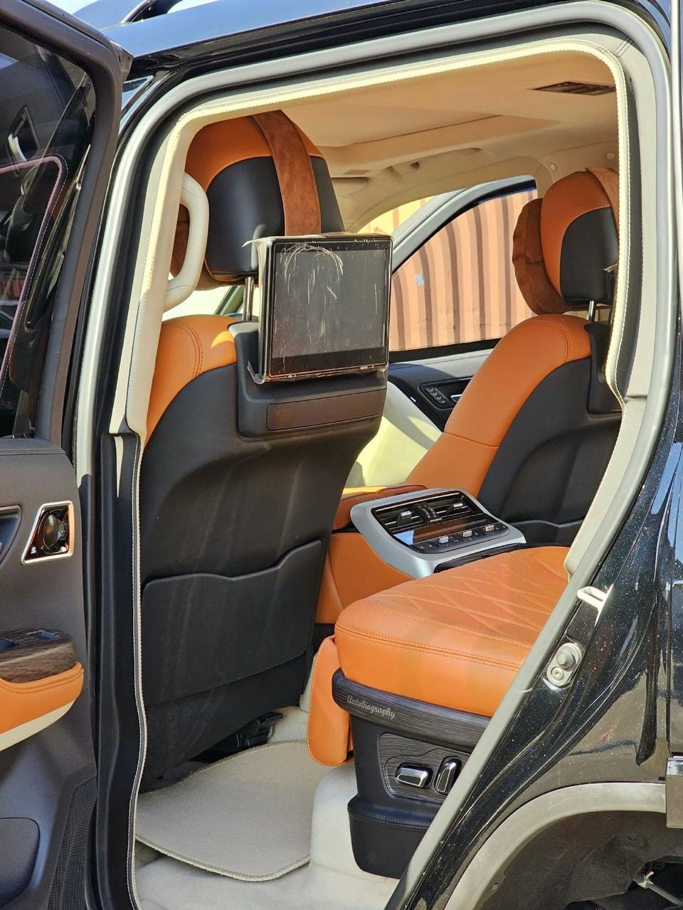 Toyota Land Cruiser 300 VXR luxury rear cabin with tan leather and entertainment screens