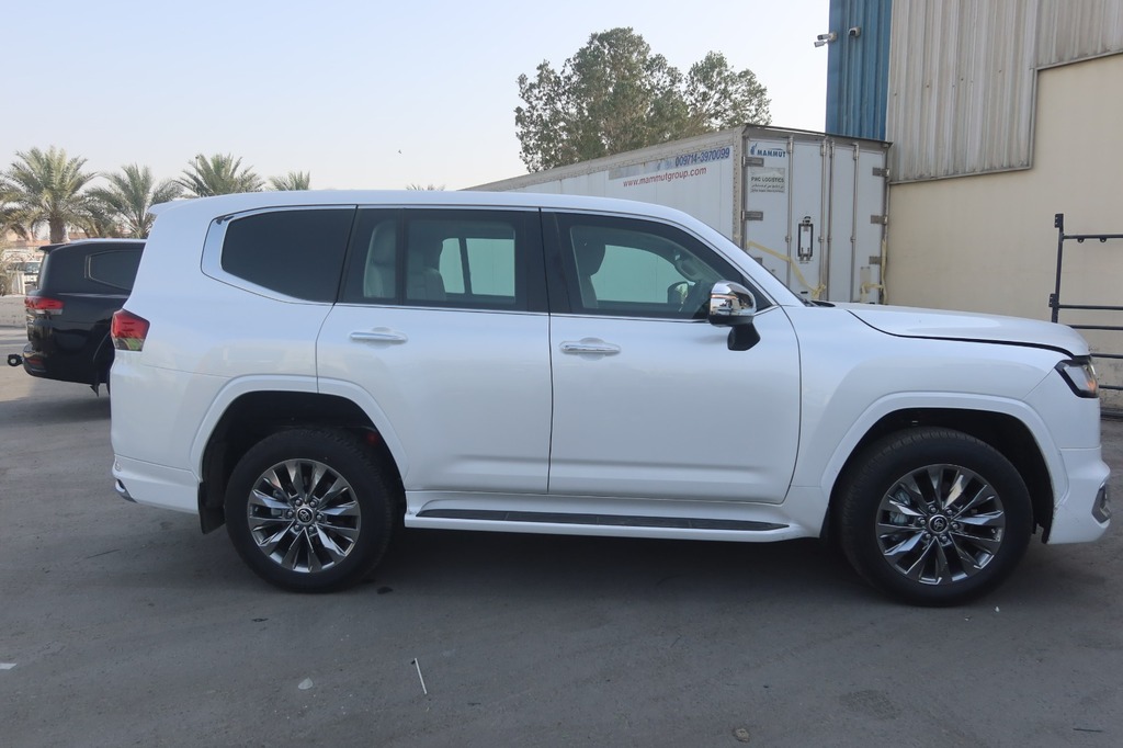 Toyota Land Cruiser ZX full side profile in pearl white with chrome trim
