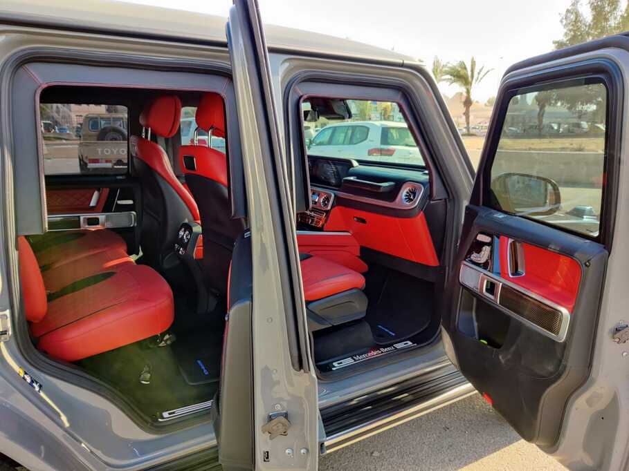 Mercedes-Benz G500 side access view with grey exterior and high-clearance stance