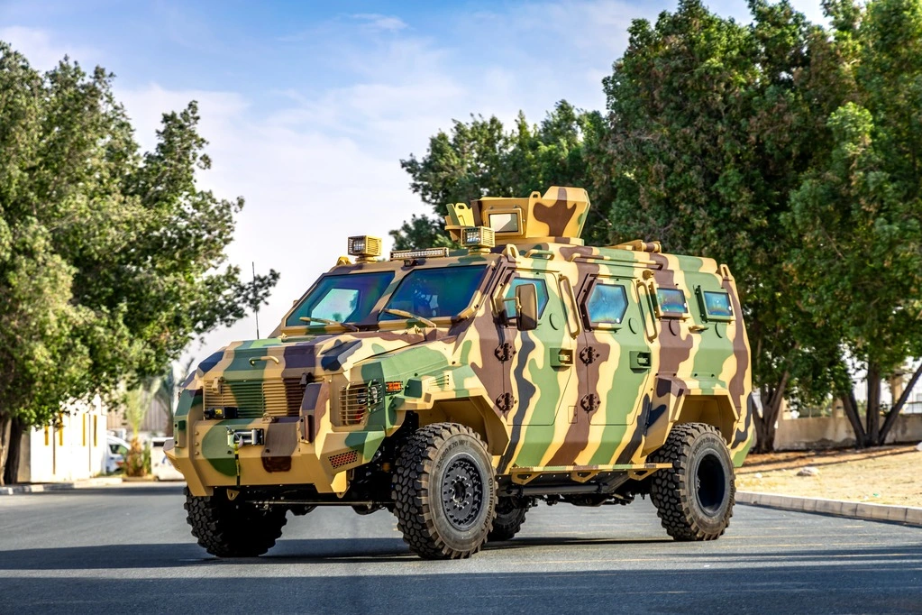 Three-quarter view of Ford F-550 APC CAMO designed for secure personnel transport in conflict zones with full perimeter protection