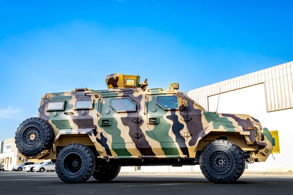 Ford F550 APC Camo side profile with reinforced doors and ballistic windows