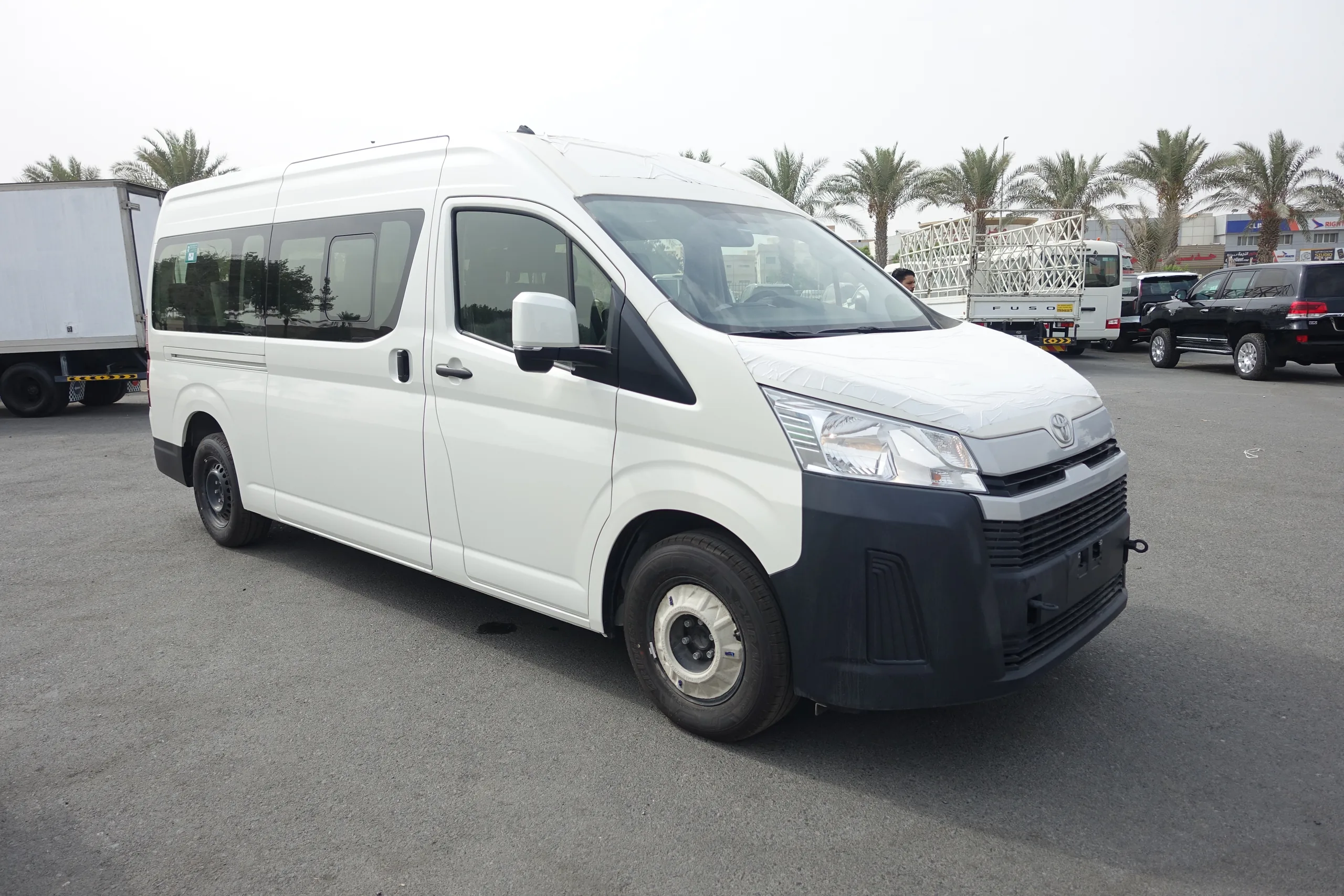 Armored Toyota Hiace 3.5L passenger carrier, white exterior three-quarter view